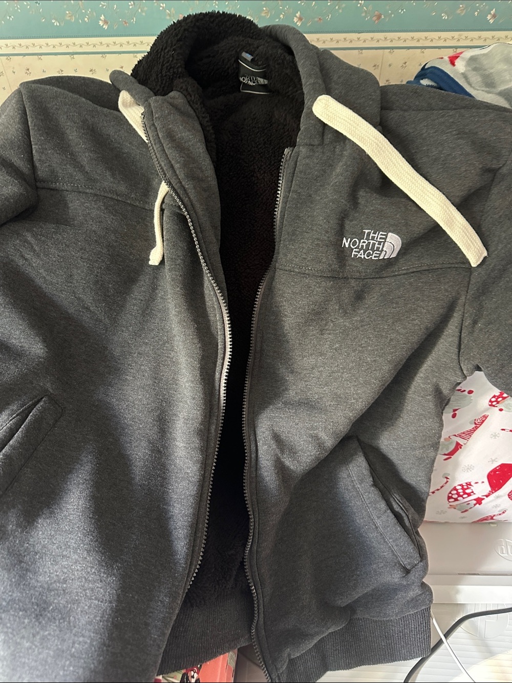 The North Face women’s Gray Hooded Puffer Jacket with Fleece Lining